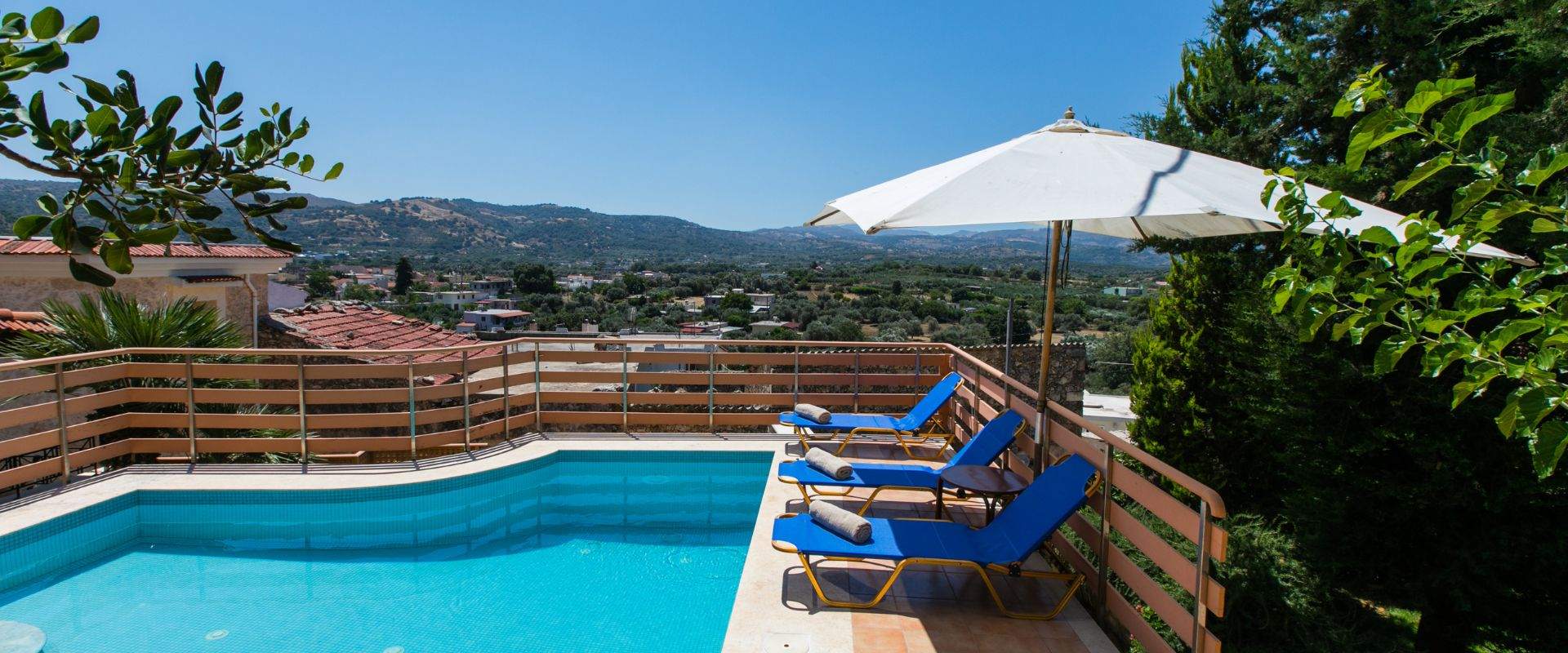 Private pool and sun terrace at Bezari Pool Villa overlooking the hills of Rethymno, Crete
